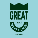 A badge featuring a crown and the phrases GREAT WORKPLACES by BVA and SILVER displayed against a pale blue background.